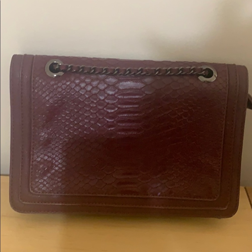 Burgundy leather bag with shoulder strap